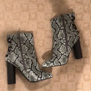 Snake print heeled booties. Never worn.